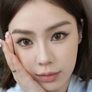 A stunning young woman with Shewincosmetic lash extensions demonstrating her applied eyeliner makeup