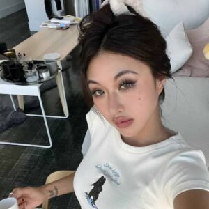 A young woman showcasing her dramatically curled lashes