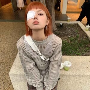 Young Female Client with Post-Extension Stye Applying Therapeutic Eye Patch
