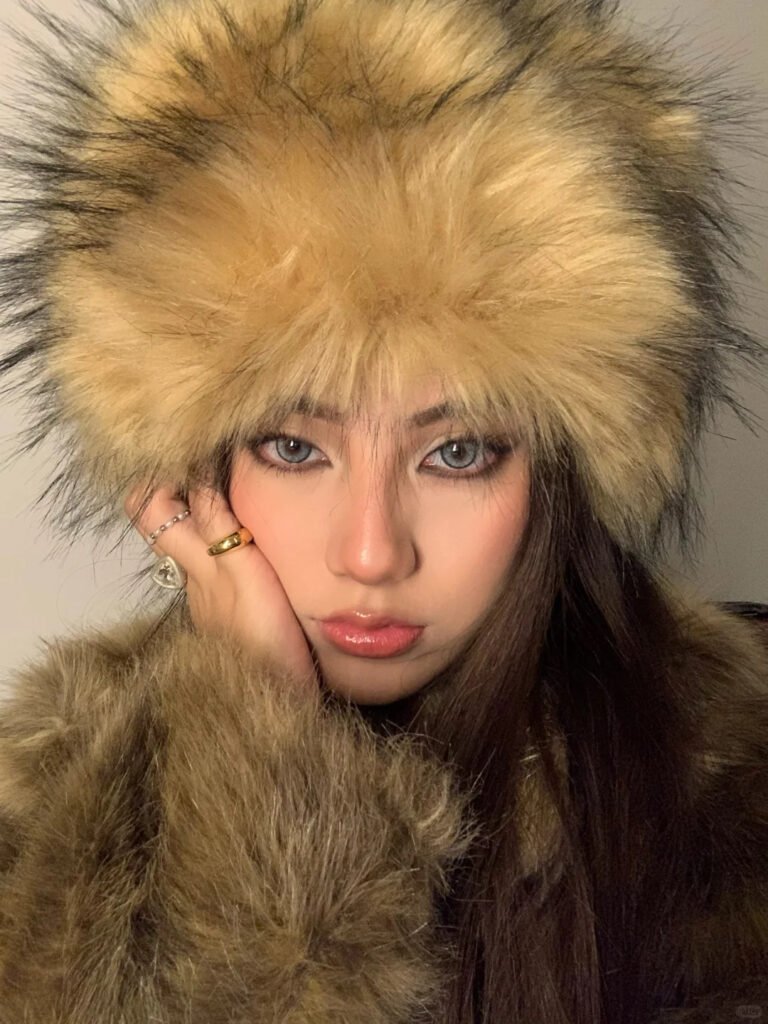 A model showcasing an elegant Russian-style makeup look, featuring Shewincosmetic's Russian volume lashes as the focal point for a dramatic, eye-opening effect