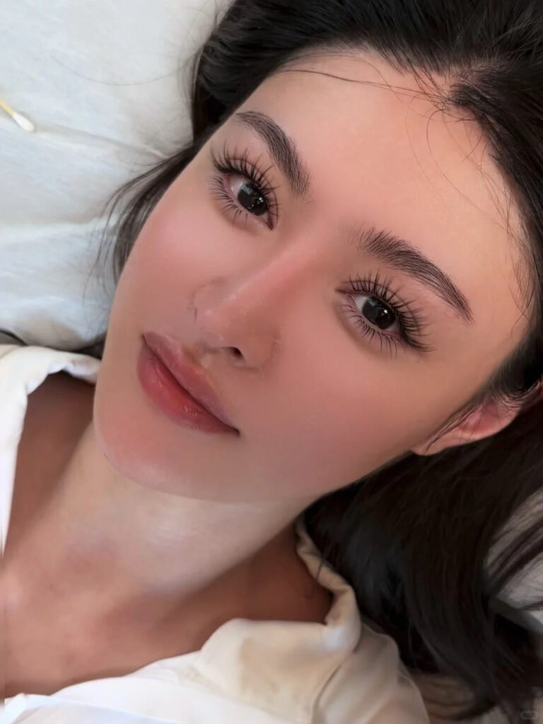 A beautiful young woman confidently wearing Shewincosmetic strip lashes, demonstrating how proper application results in a natural, long-lasting look.