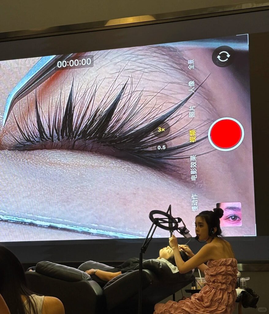 Professional Shewincosmetic instructor teaching students during an Eyelash Extension Training class.