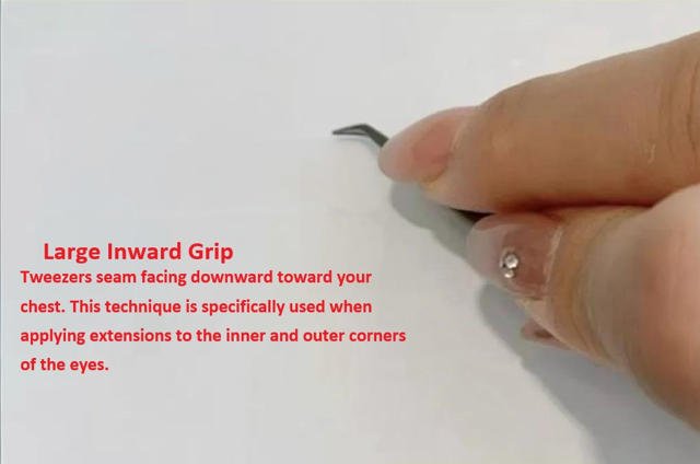 Large inward lash extension grip - tweezers seam facing downward toward chest, designed for third layer and corner precision